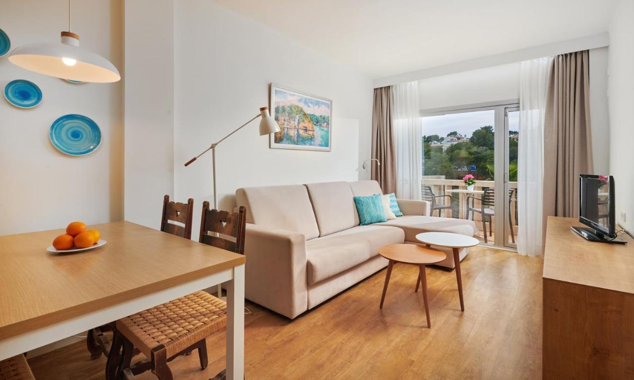 Hotel Apartamentos Cala Сантаньи Экстерьер фото